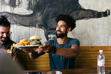 Man at restaurant with hamburger