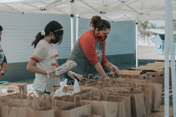 Volunteers packing meals